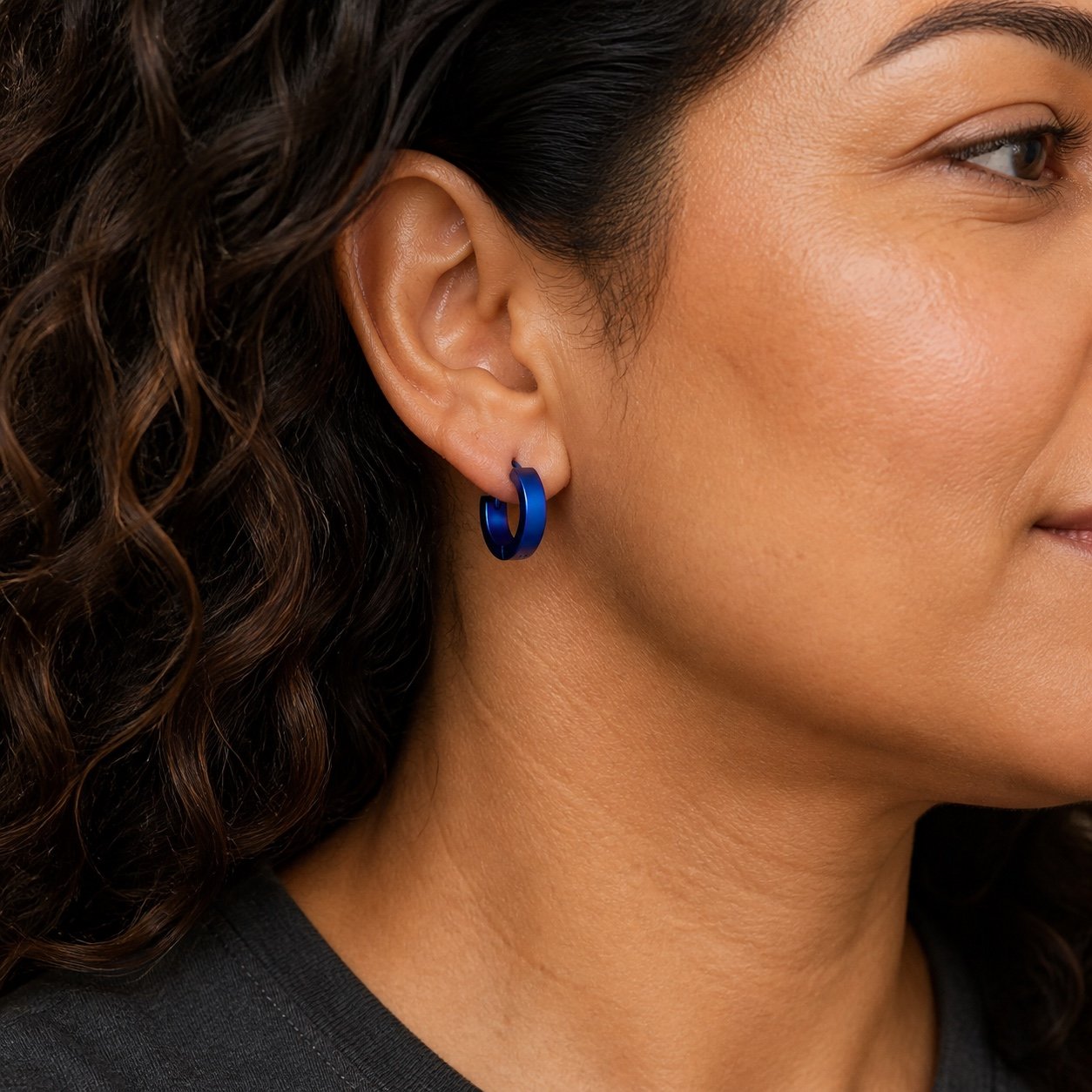 14mm Blue-Finish Stainless Steel Hoop Earrings — close worn view 14mm Blue-Finish Stainless Steel Hoop Earrings — close worn view