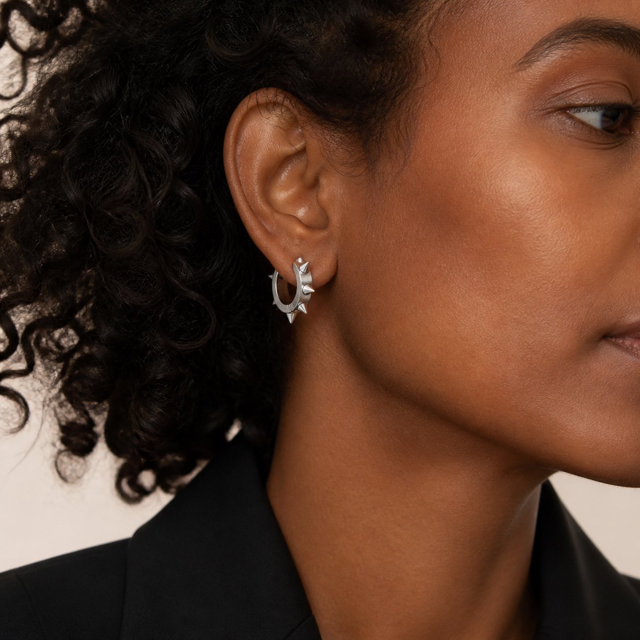 20mm polished stainless steel spike hoop earrings — close worn view 20mm Polished Stainless Steel Spike Hoop Earrings — close worn view