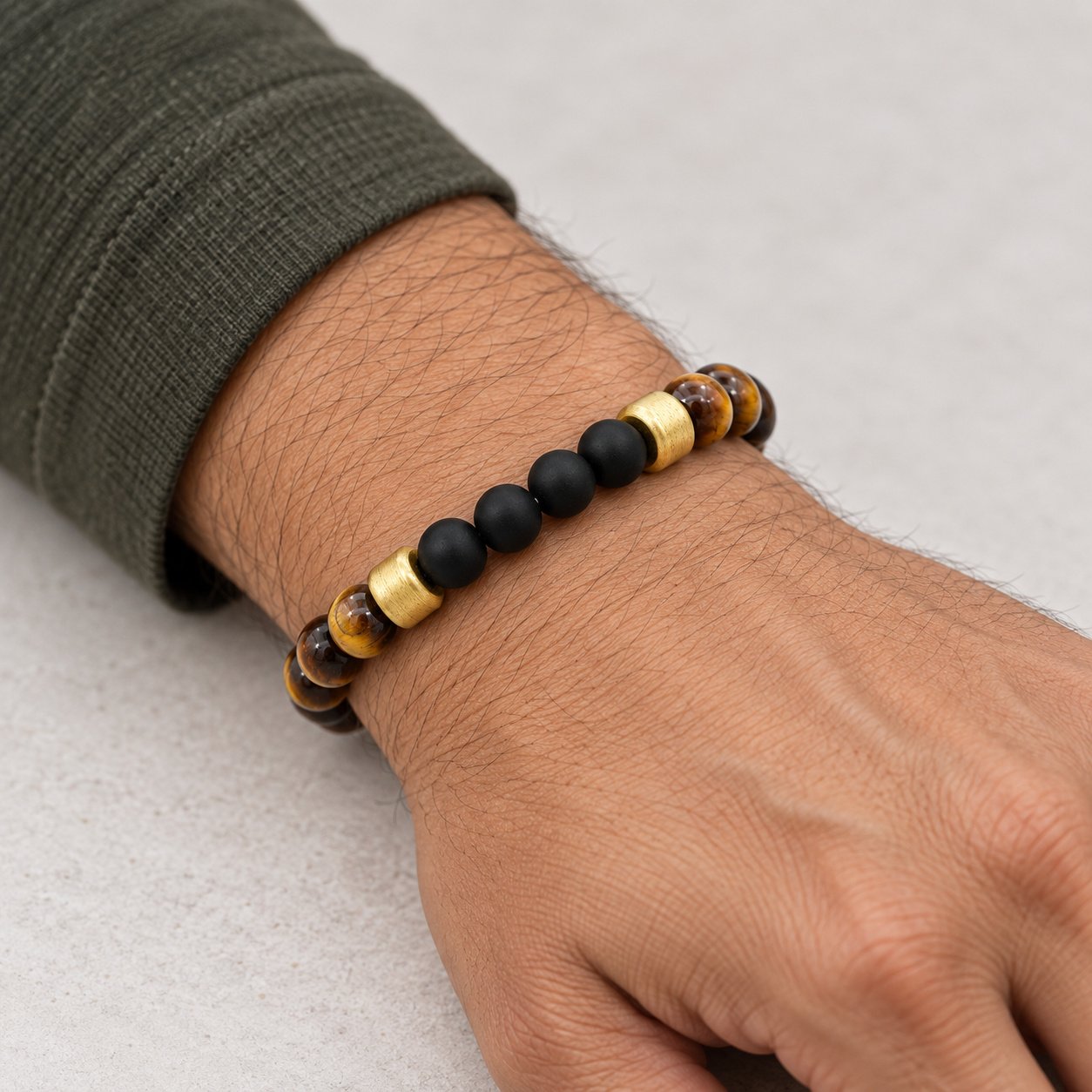 onyx & tiger eye gold tone beaded bracelet — close worn view Onyx & Tiger Eye Gold-Tone Beaded Bracelet — close worn view