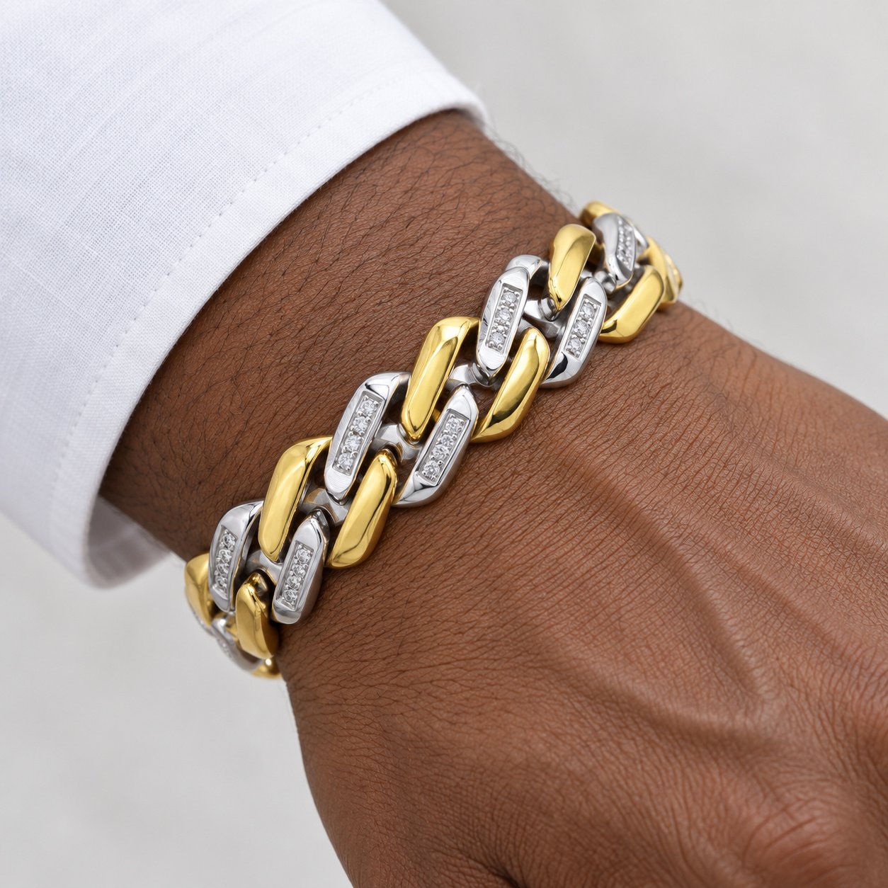 two tone gold & steel cz curb link bracelet — close worn view Two-Tone Gold & Steel CZ Curb-Link Bracelet — close worn view