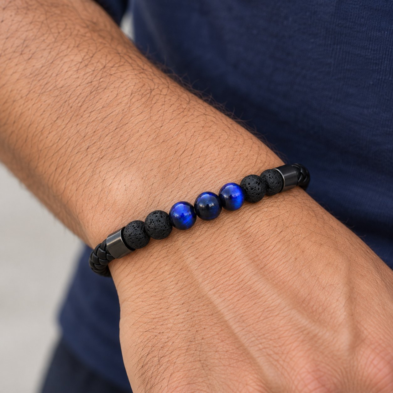 blue tiger eye & lava bead leather bracelet — close worn view Blue Tiger Eye & Lava Bead Leather Bracelet — close worn view